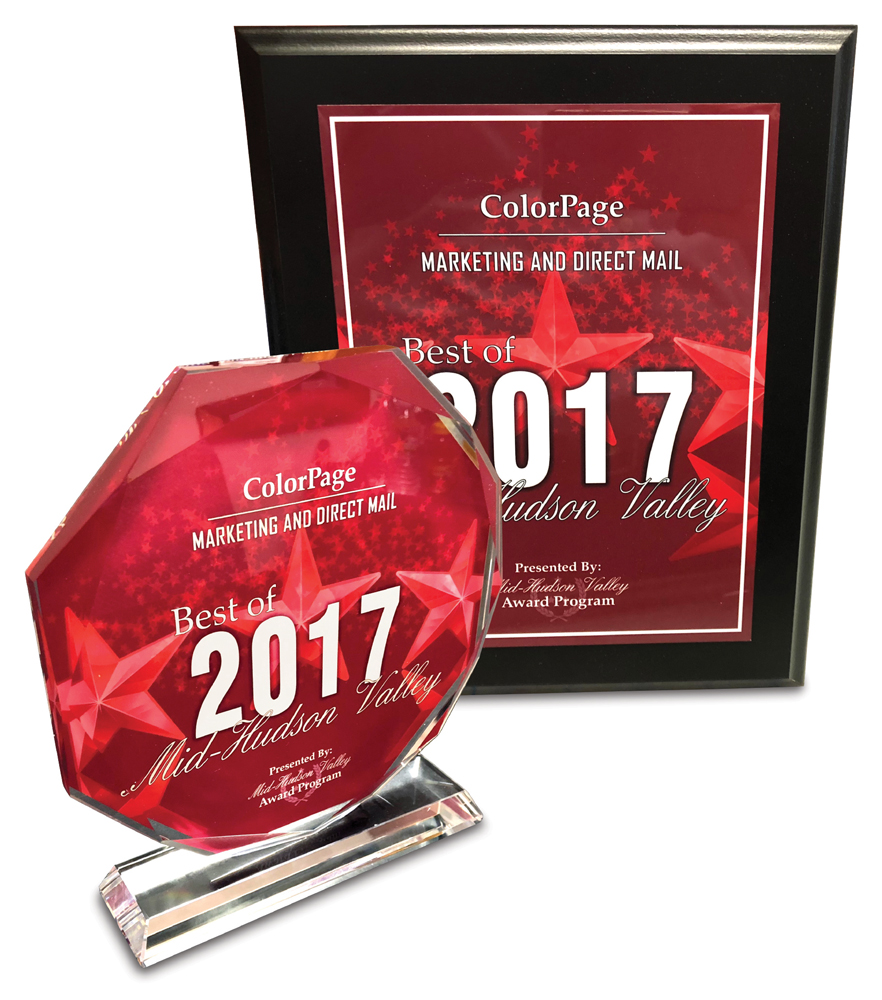 colorpage plaque and desk sitting red awards for winning the marketing award in 2017